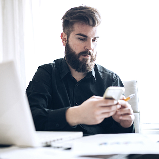 man looking into her mobile
